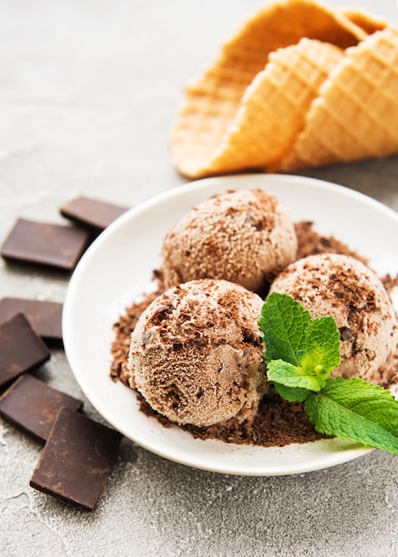 Chocolate ice cream on a stone background