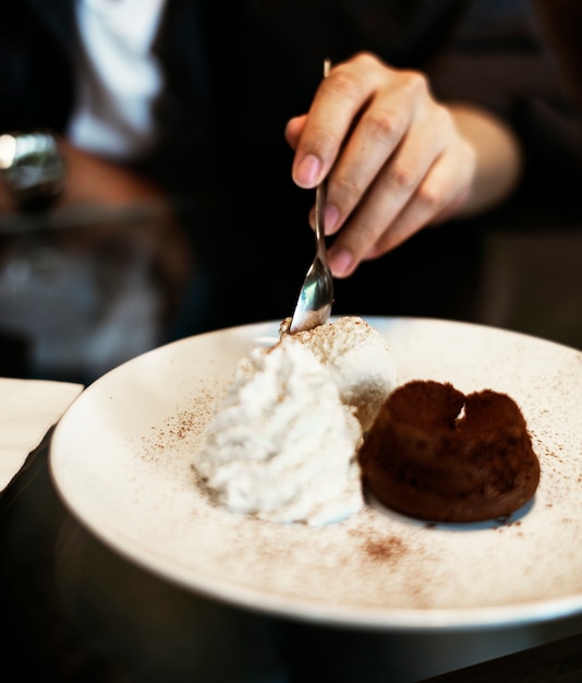 Chocolate lava cake with ice cream and whip cream sweet dessert