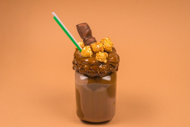 Chocolate milkshake with whipped cream cookies waffles served in glass mason jar Freak or crazy sweet shake