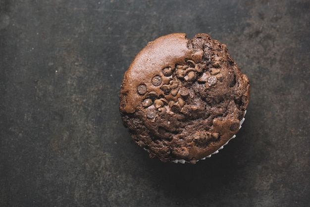 chocolate muffin on dark background with copy space for individual text