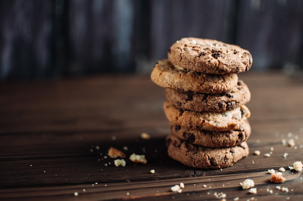 Chocolate oatmeal chip cookies on the rustic wooden table, copy space