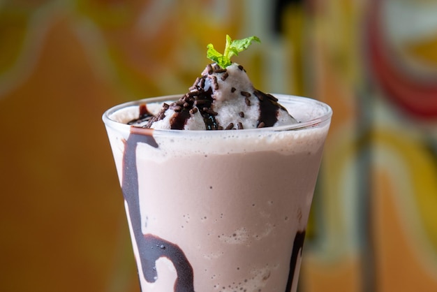 Chocolate Smoothie served in disposable glass isolated on table top view of arabian food