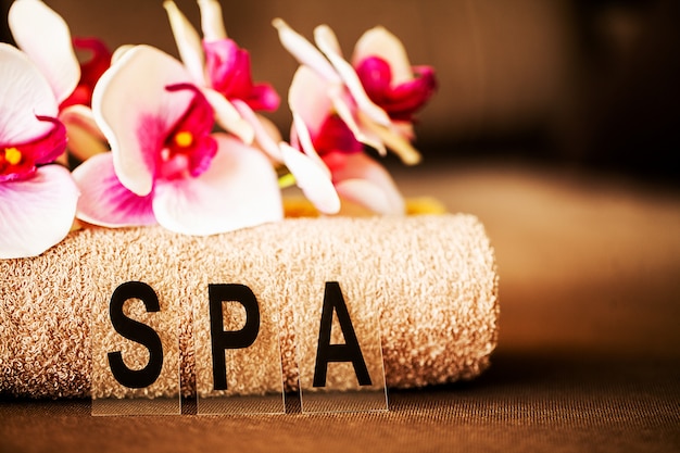 Chocolate Spa . Composition brown towel in hotel room of spa treatment