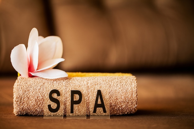 Chocolate Spa . Composition brown towel in hotel room of spa treatment