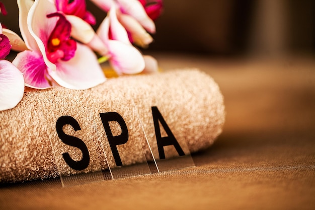 Chocolate Spa Composition brown towel in hotel room of spa treatment