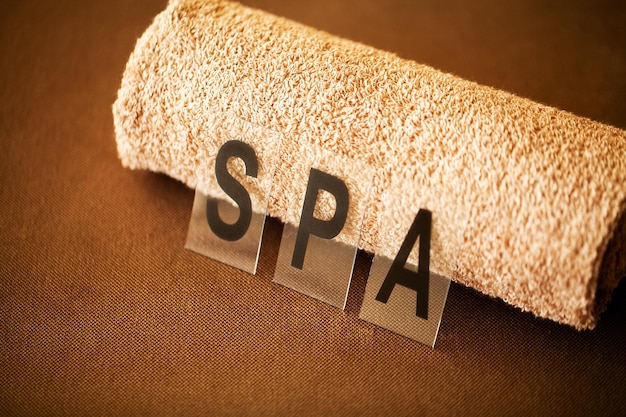 Chocolate Spa Composition brown towel in hotel room of spa treatment