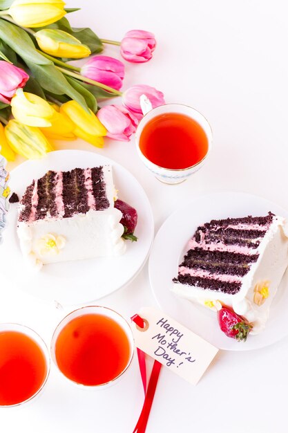 Chocolate Strawberry Lemon Torte made with 6 layers of chocolate cake, filled with lemon curd and strawberry mousse, covered in white chocolate cream cheese frosting.