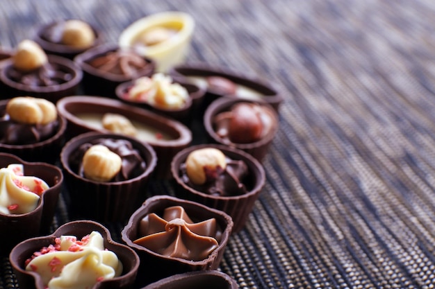 Chocolate sweets on fabric background