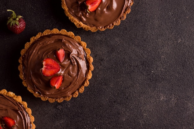 Chocolate tart on a black background. view from above. copy space