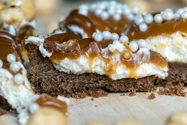 Chocolate tartlet with cream filling and salted caramel with nuts