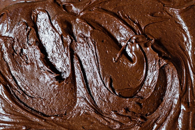 Chocolate texture mousse with pieces of chocolate drops Raw dough for making American brownie