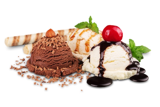 Chocolate, vanilla and strawberry ice cream with sauces