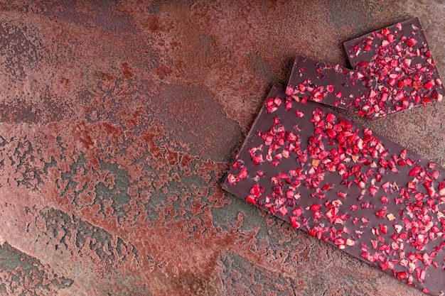 Chocolate with Pieces of Dried Strawberries Lies a Stack