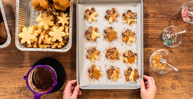 Chocolatedipped gingerbread men with golden toasted coconut