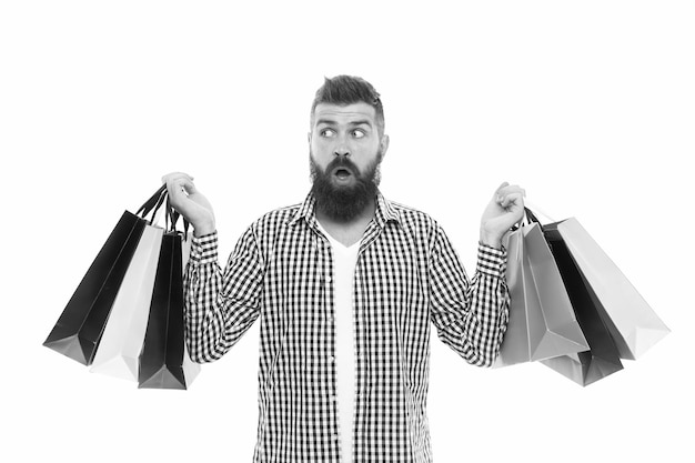 Choosing the best Black Friday Cyber Monday Bearded man with shopping bags Shopping sale Male barber care Mature hipster with beard surprised brutal caucasian hipster with moustache