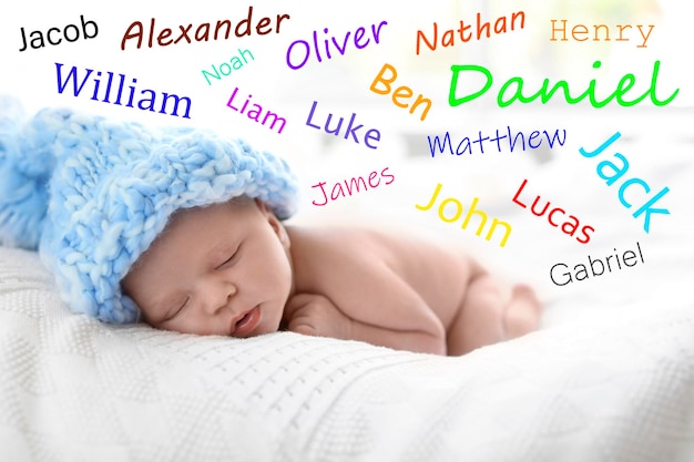 Choosing name for baby boy Adorable newborn sleeping on bed