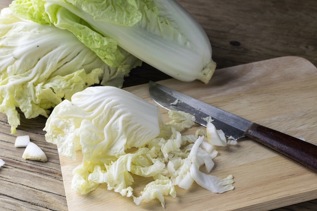 chopped chinese cabbage on wooden cutting board