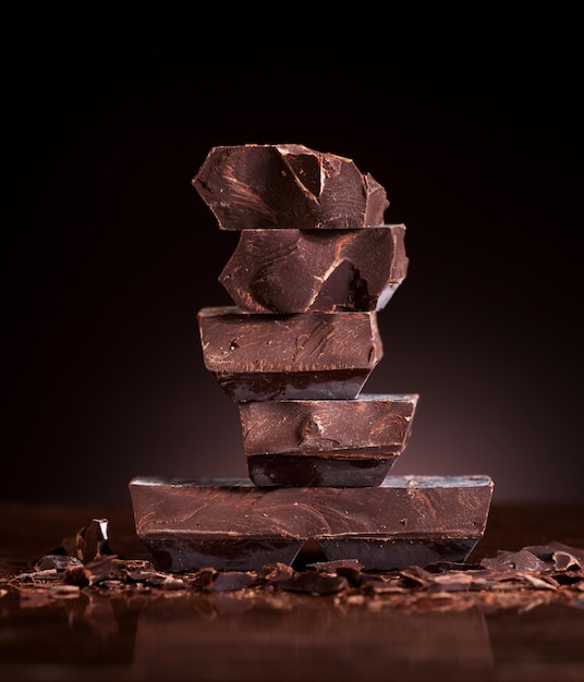 Chopped chocolate on a dark marble background