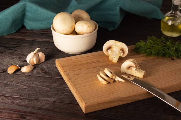 Chopped mushrooms on a wooden cutting board