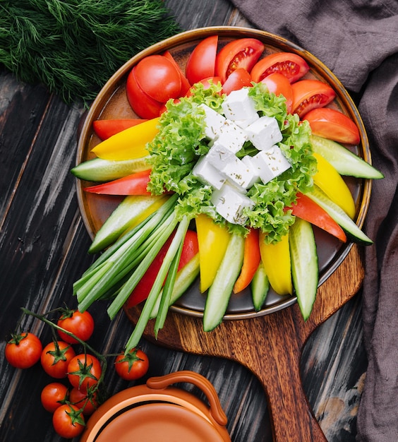 Chopped vegetables with goat cheese top view