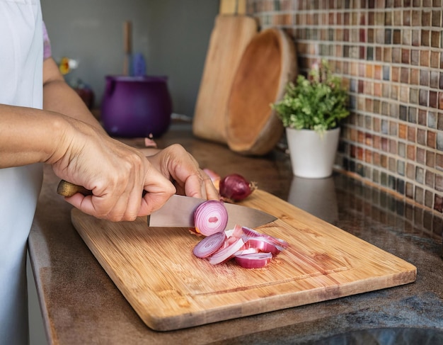 Photo chopping onions in the kitchen