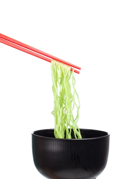 chopsticks holding Chinese vermicelli with bowl isolated on white background