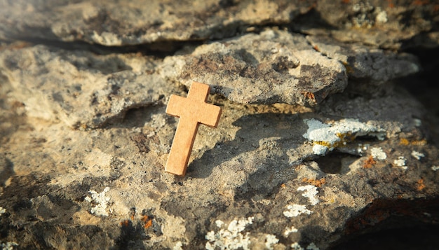 Christian cross on the outdoor stone