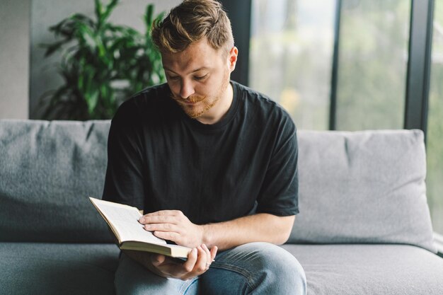 Christian man holds holy bible in hands Reading the Holy Bible in a home Concept for faith spirituality and religion Peace hope