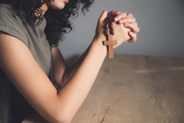 Christianity woman hand holding cross