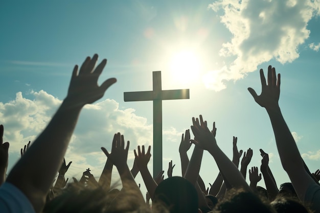 Christians with hands raised in praise worship and prayer to God at sunrise