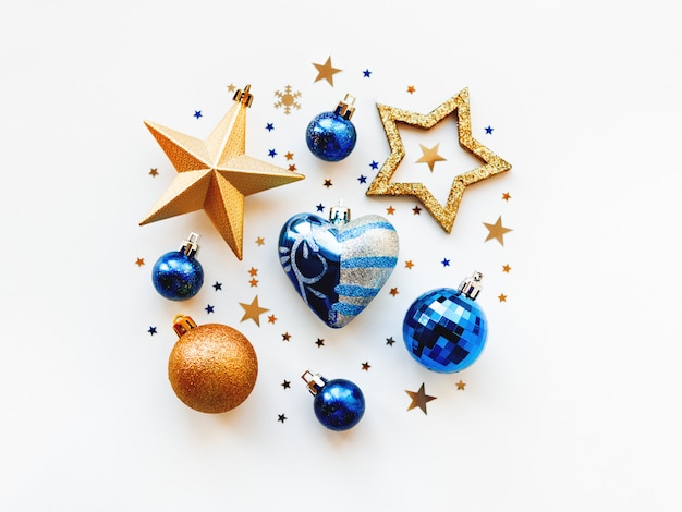 Christmas and  2020  with decorations, shaped as a circle. Golden and blue balls, stars, confetti and heart.