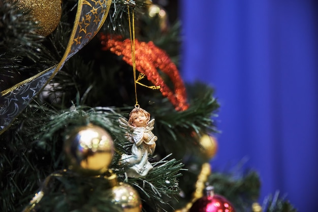 Christmas angel on Christmas tree branch