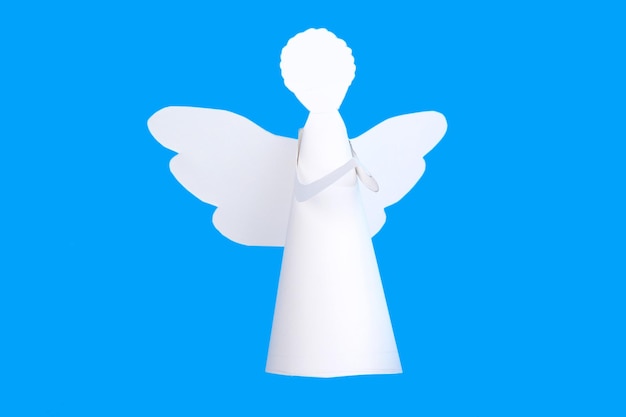 Christmas angel on light blue background