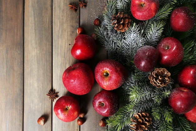 Christmas apples on wooden table