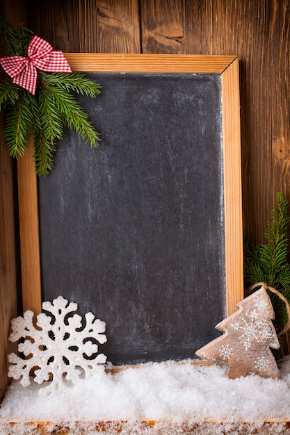 Christmas background blackboard with festive decor.