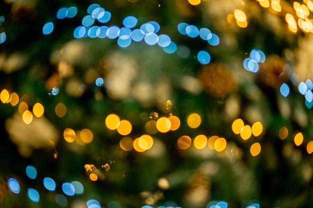 Christmas background bokeh Christmas tree bokeh light in green yellow golden color holiday abstract background blur defocused Defocused Gold Lights