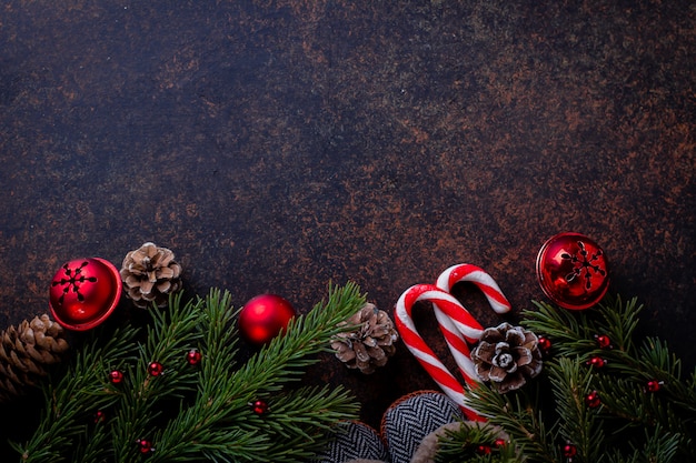 Christmas background christmas boots, choliday decoration and fir tree. Top view with copy