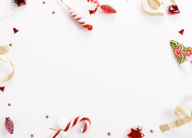 Christmas background, Christmas present red gifts box and decorating elements on white background. Creative festive Flat lay and top view composition copy space design.