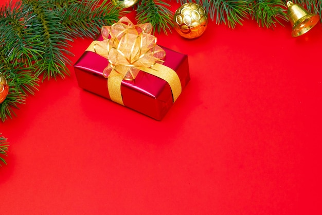 Christmas background concept Top view of Christmas gift box gold balls with spruce branches