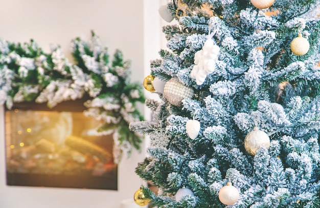 Christmas background fireplace and Christmas tree, Selective focus.