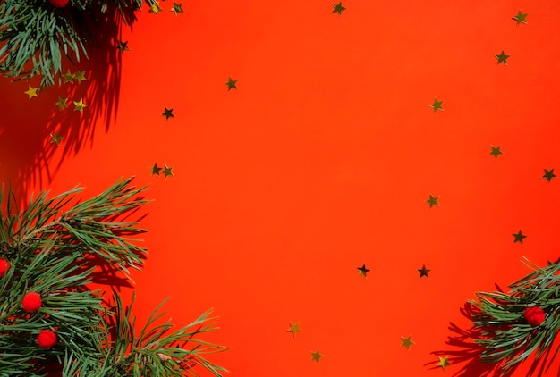 Christmas background with a Christmas tree on a red background Merry Christmas card Winter holiday theme Happy New Year Place for your text