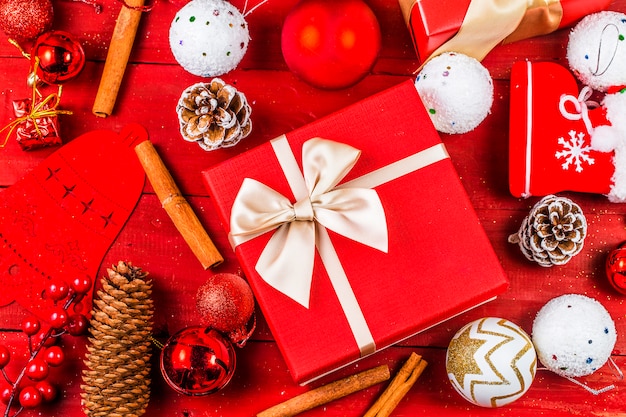 Christmas background with decorations and gift boxes on wooden board