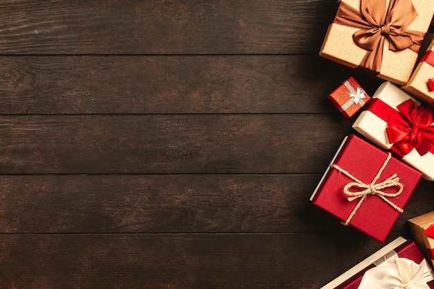 Christmas background with gift boxes on wooden table