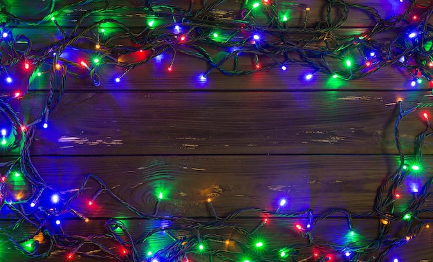 Christmas background with lights and free text space. Christmas lights. Glowing colorful Christmas lights . New Year. Garland.