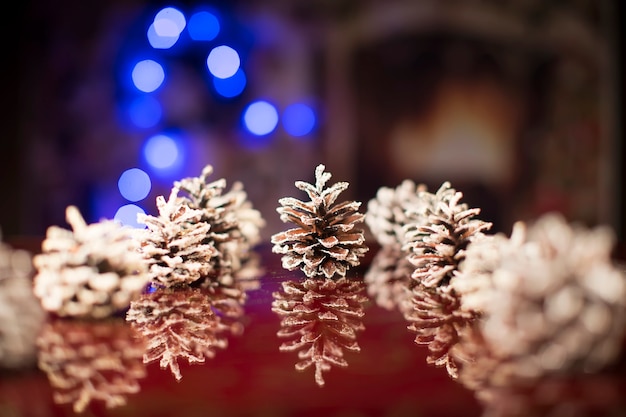 Christmas background with pine cones and bokeh spots