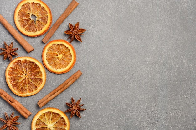 Christmas Background with Winter Spices and Slices of Dried Orange 