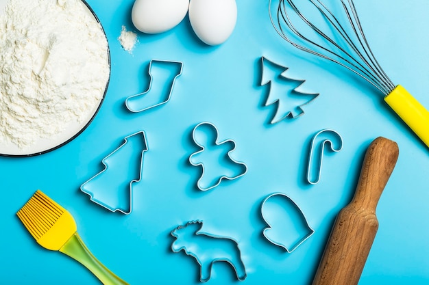 Christmas baking background christmas cookie cutters molds on the kitchen baking table festive food ...