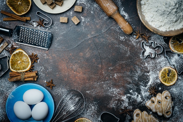 Christmas Baking background. Ingredients for cooking christmas baking on dark background. copyspace. Christmas mood.