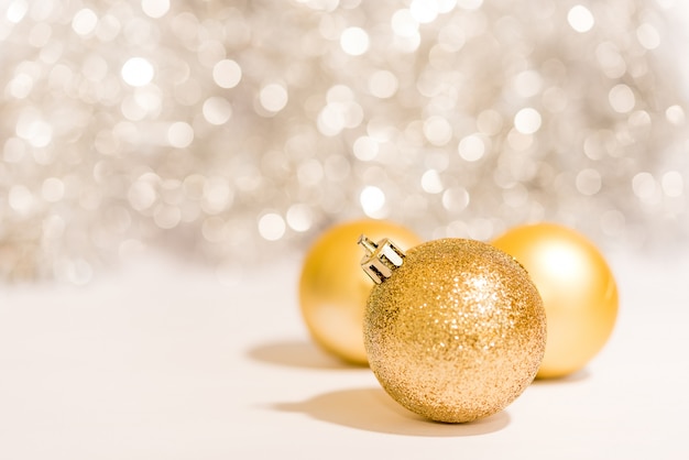 Christmas ball ornament decoration over golden background