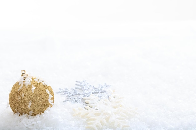 Christmas ball and snow on white background